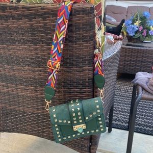 Hunter green gold studded delineate fun bag.